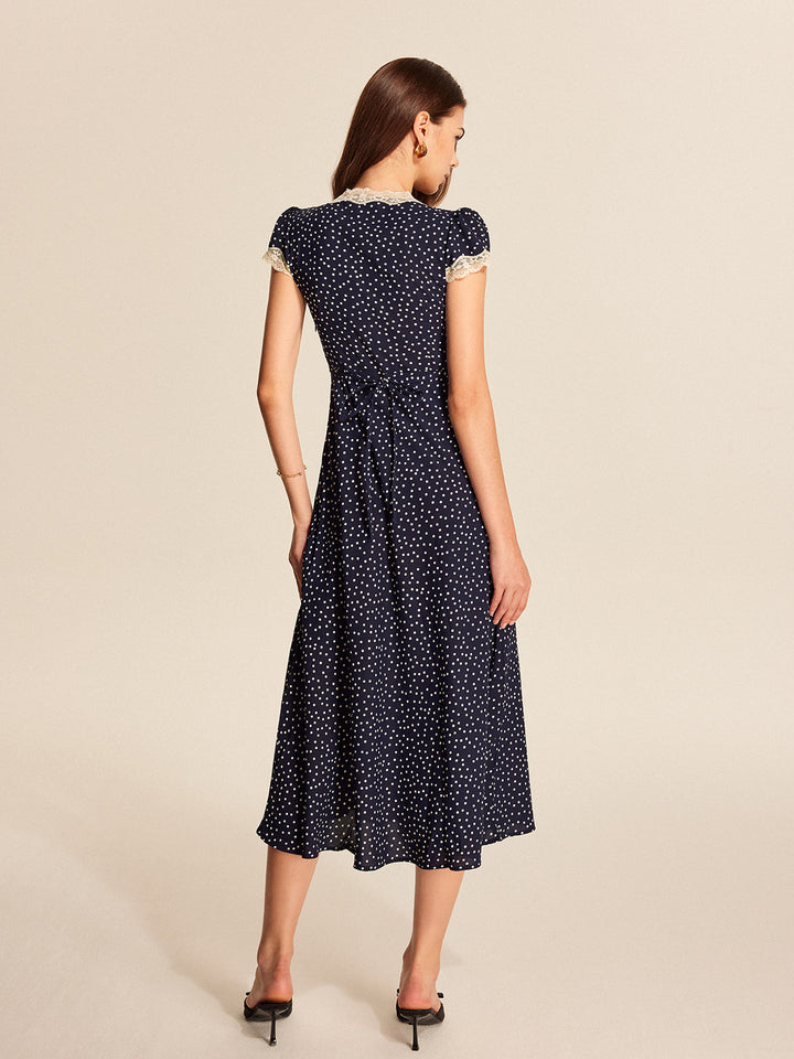 Abito con pizzo a pois